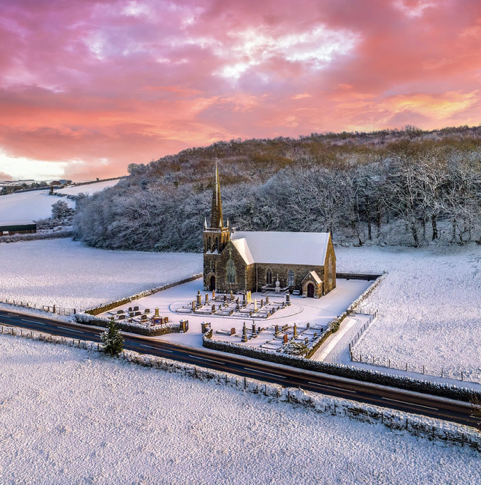 St James Church - Parish of Donagheady. Gareth Wray, the photographer, adds: ‘This picturesque little church & cemetery was constructed in 1879 to house a congregation of 300 worshipers from the local parish. I love its placement as it fringes on the local Donemana village border. Idyllically seated so even today it’s not congested & surrounded by “sprung up” modern constructions around it. St James Church still stands proudly on a natural open-air landscape, surrounded by lush rolling green fields & to its rear an ancient woodland likely predating the church itself. Its clean natural blend with its environment is a timeless credit to both its builders & its current custodians.’