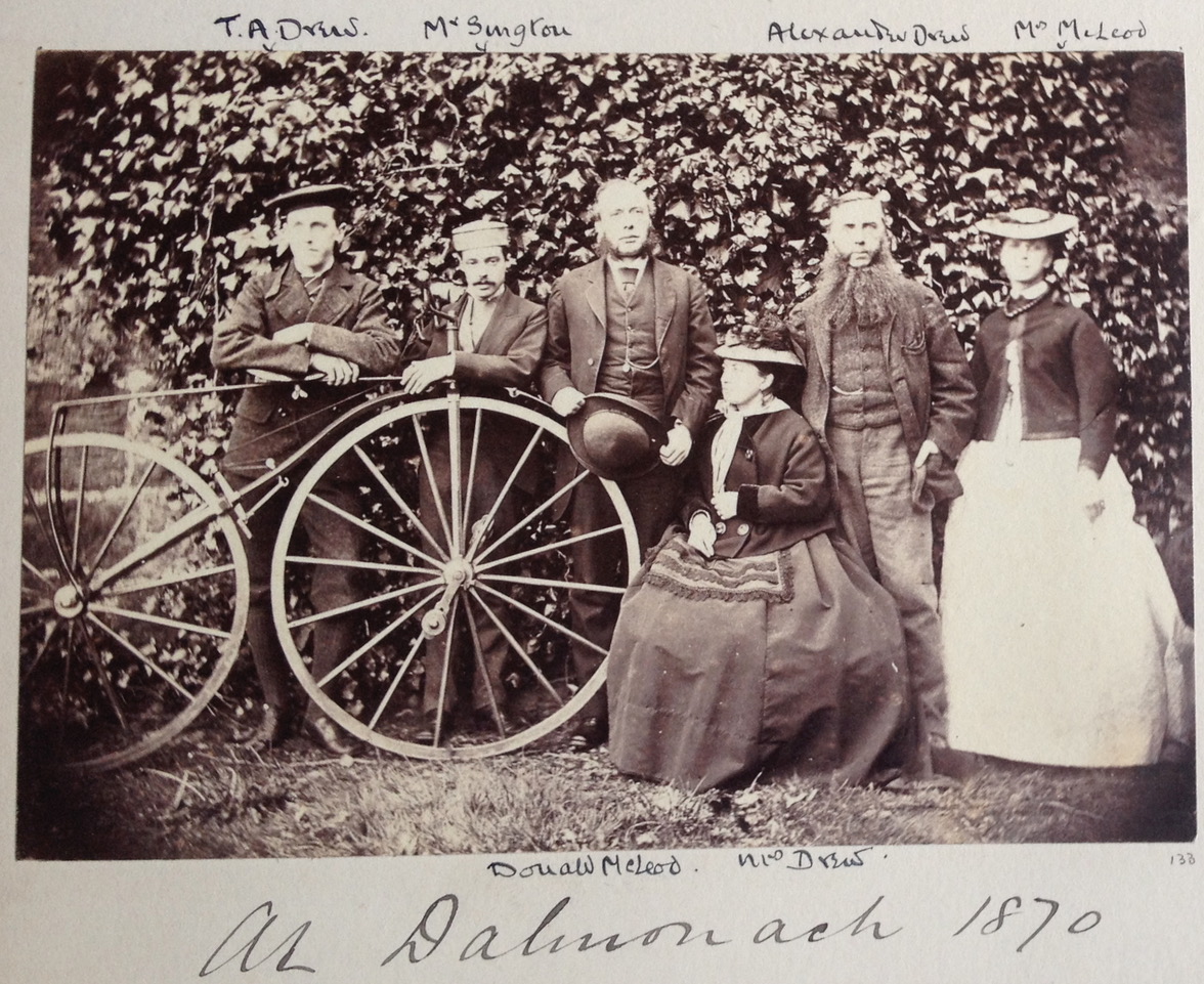 Tom Drew, Mr Syngton, Donald Mcleod, Mrs Drew, Alexander drew and Mrs McLeod, with bicycle, at Dalmanoch in 1870.