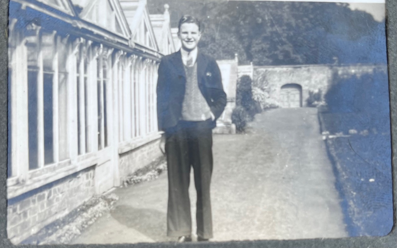 Willie Willis in Lisnavagh walled garden, Summer 1941. The greenhouse along the left was dismantled in the late 1970s when the swimming pool garden was built.